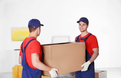 Moving team handling items safely during a van removal job
