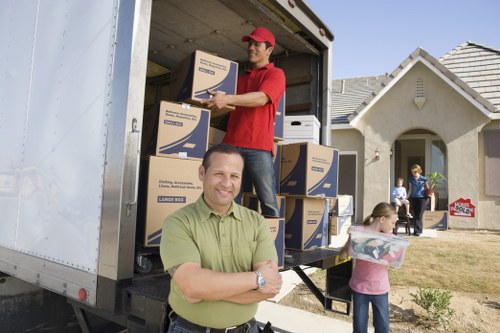 Staff wearing PPE during a house move