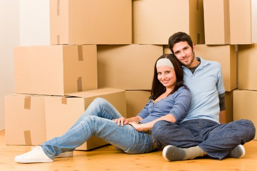 Packed boxes and moving equipment ready for a local removal service