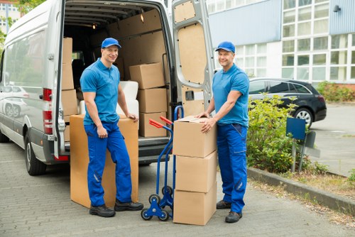 Packed moving boxes and furniture ready for removal service