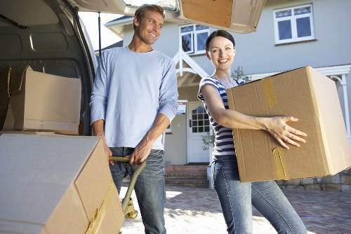 Careful manual handling and secure item placement in a van